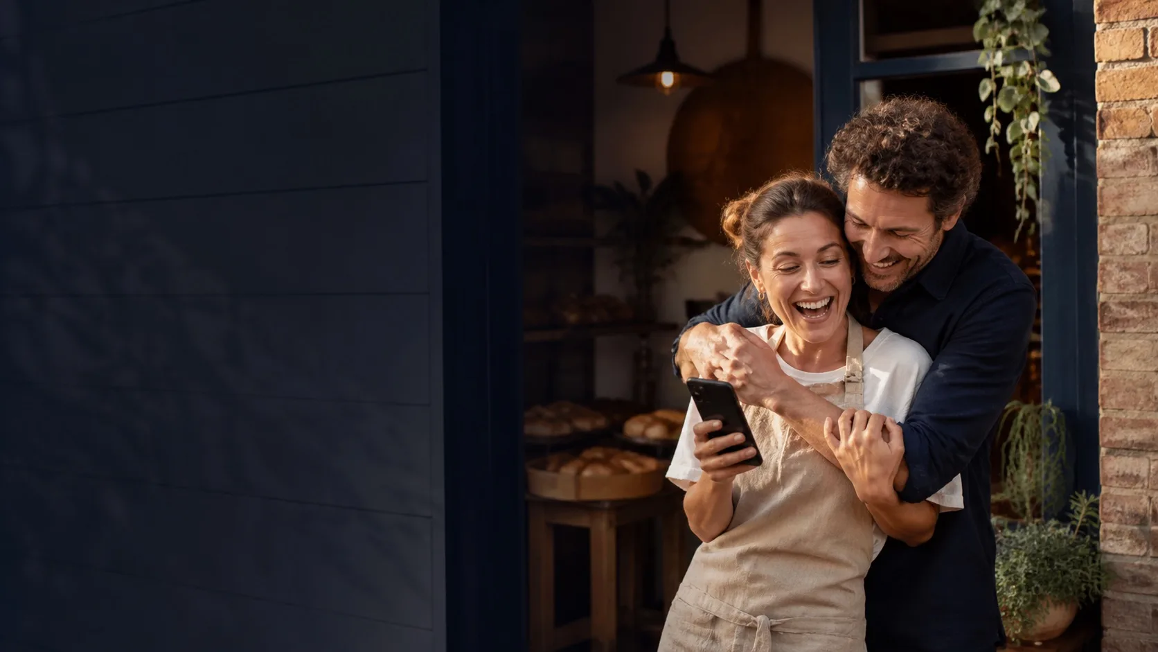 A self-employed Australian business owner sharing joyful news with her partner